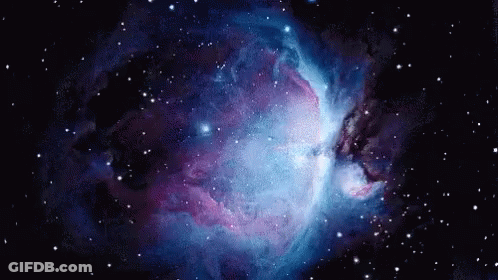 A Purple And Blue Galaxy With Lots Of Stars In It GIF