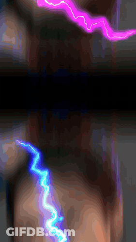 A Purple And Blue Lightning Strike On A Dark Background GIF