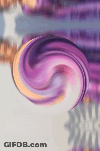 A Purple And Orange Swirl On A Gray Surface GIF