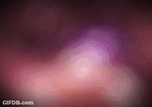 A Purple And Pink Colored Background With A Swirl In The Middle GIF