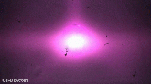 A Purple Background With A White Light Coming Out Of It GIF