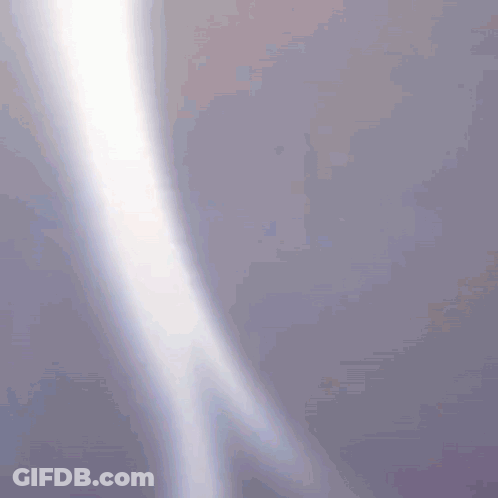 A Purple Background With A White Light Coming Out Of The Corner GIF