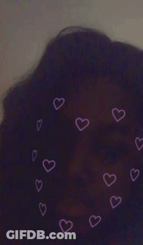 A Purple Background With Pink Hearts Around A Person 'S Head GIF