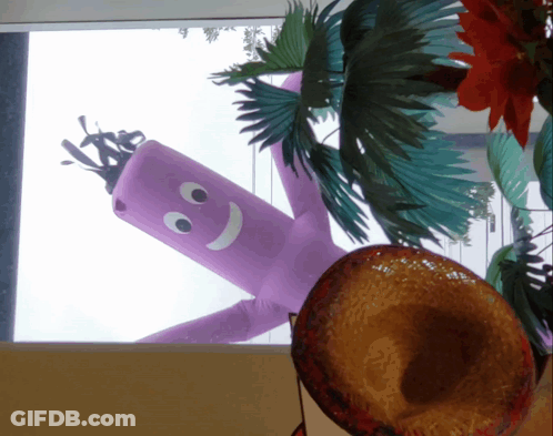 A Purple Balloon With A Smiley Face On It Is Hanging From The Ceiling GIF