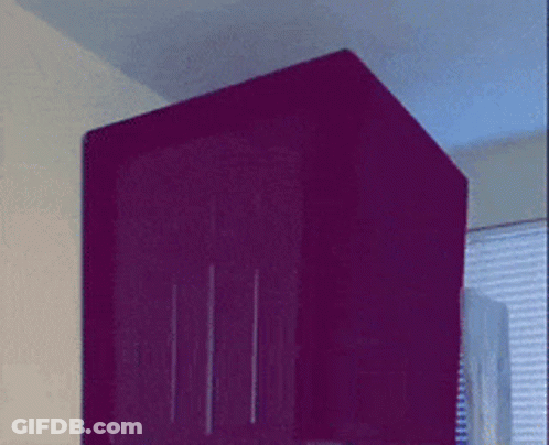 A Purple Box With A Blue Light On The Top Of It GIF