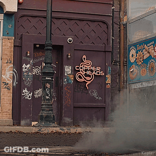 A Purple Building With A Neon Sign That Says Copper Heads On It GIF