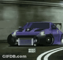 A Purple Car Is Driving Down A Curvy Road . GIF