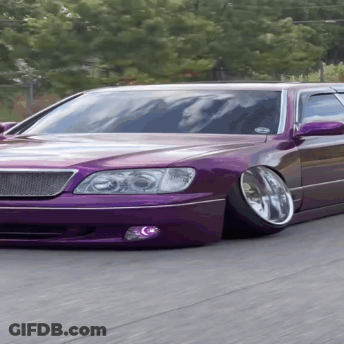 A Purple Car With A Sticker On The Windshield That Says " Always " GIF