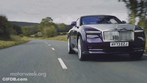 A Purple Car With The License Plate Hy73 Ezj Is Driving Down A Road GIF
