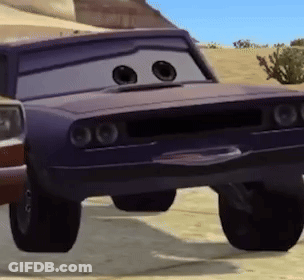 A Purple Cartoon Car With Big Eyes Is Parked In A Desert . GIF
