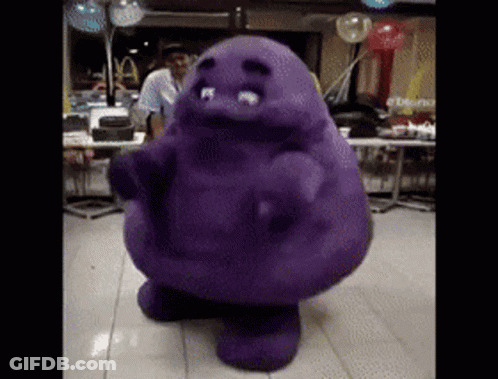 A Purple Cartoon Character Is Dancing In A Room With Balloons GIF