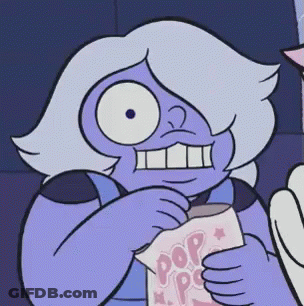 A Purple Cartoon Character Is Holding A Bag Of Popcorn GIF