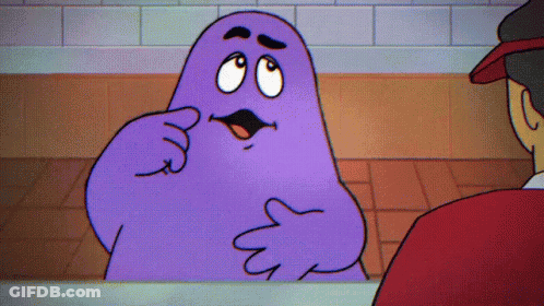 A Purple Cartoon Character Is Talking To A Man GIF
