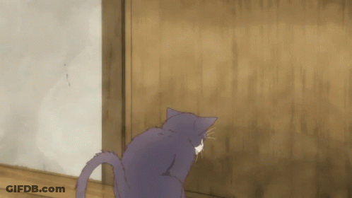 A Purple Cat Is Looking At A Wooden Door GIF