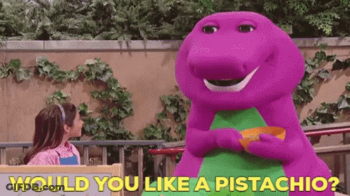 A Purple Dinosaur Is Holding A Bowl Of Pistachios Next To A Little Girl . GIF