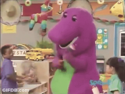 A Purple Dinosaur Is Standing Next To A Green Dinosaur In A Room With Children . GIF