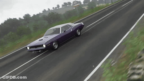 A Purple Dodge Challenger Is Driving Down The Road GIF