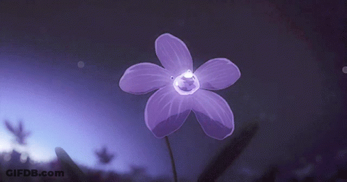 A Purple Flower Is Glowing In The Dark GIF