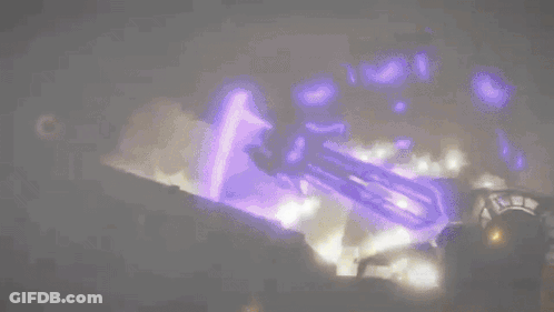A Purple Light Is Shining On A Dark Background . GIF