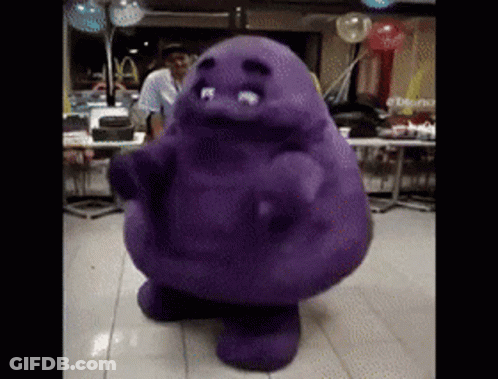 A Purple Mascot Is Dancing In A Restaurant With Balloons In The Background GIF
