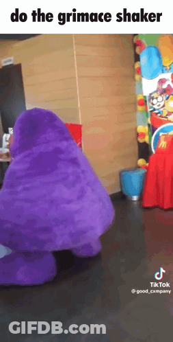 A Purple Mcdonald 'S Mascot Is Dancing In A Room With The Caption Do The Grimace Shaker GIF