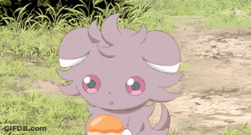 A Purple Pokemon With Pink Eyes Is Eating A Donut In The Grass . GIF