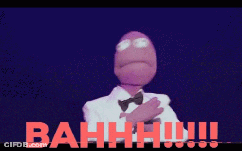 Purple Puppet In Tuxedo And Bow Tie In Front Of Bah GIF
