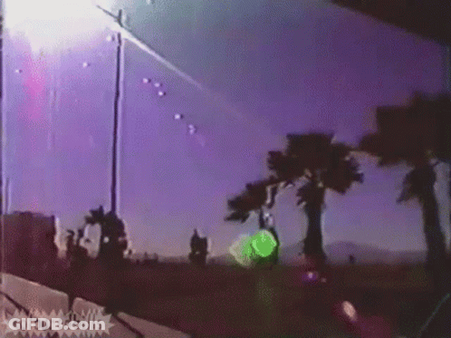 A Purple Sky With Palm Trees In The Foreground And The Words Colouredbills On The Bottom Right GIF