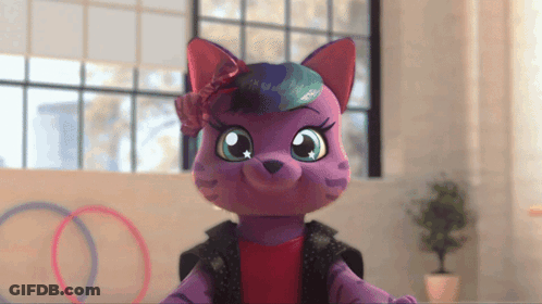 A Purple Stuffed Animal With A Flower In Its Hair GIF
