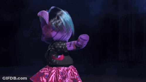 A Purple Teddy Bear Is Holding A Microphone And Pointing At The Camera GIF