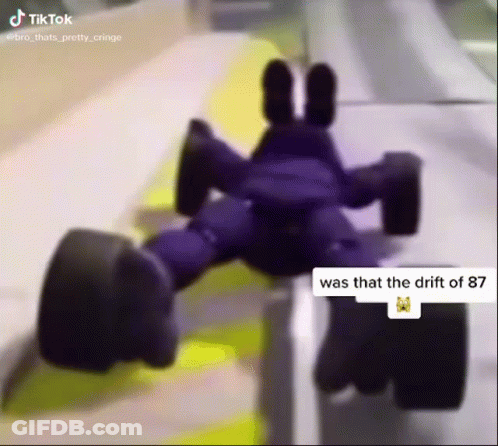 A Purple Toy Car That Says Was That The Drift Of 87 On It 'S Side GIF
