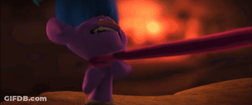 A Purple Troll With Blue Hair Is Holding A Pink Stick To His Neck . GIF