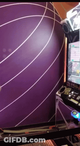 A Purple Wall With White Lines On It Is Behind A Video Game GIF