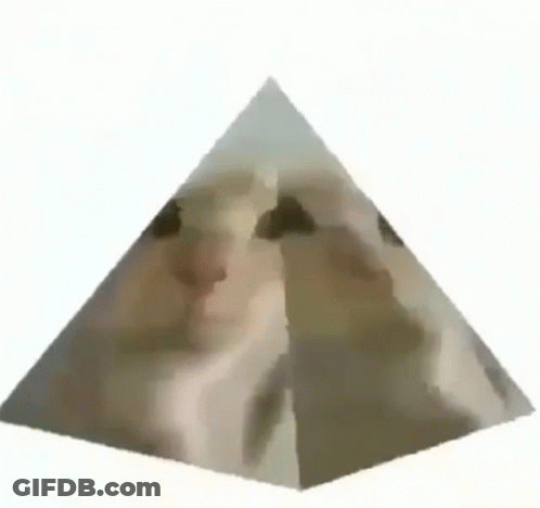 A Pyramid With A Cat 'S Face On Top Of It . GIF