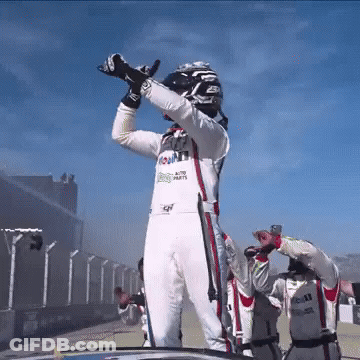 A Race Car Driver Wearing A Uniform That Says Mobil GIF