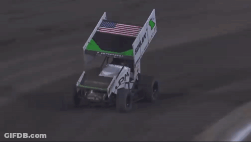 A Race Car Is Crashing Into A Fence And Flying Through The Air . GIF
