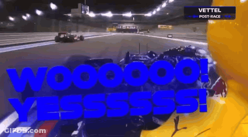 A Race Car Is Driving Down A Race Track And The Words Wooooo Yesssss Are Written In Blue GIF