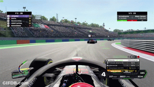 A Race Car Is Driving Down A Track With A Martin Logo On The Side GIF