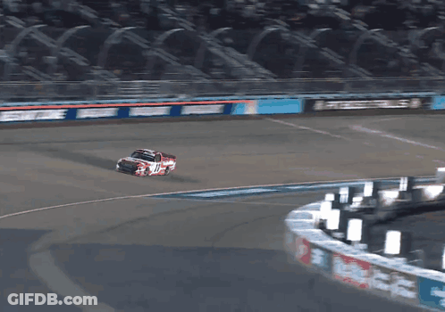 A Race Car Is Going Around A Curve On A Track With A Sign That Says ' Busch ' On It GIF