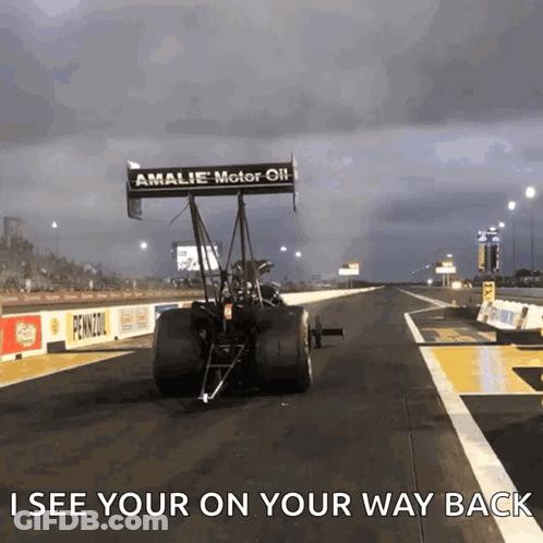 A Race Car Is On A Track With The Words " See Your On Your Way Back " GIF