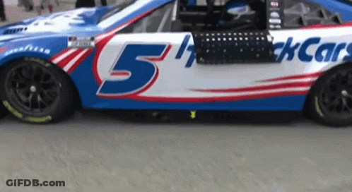 A Race Car That Has The Number 5 On It GIF