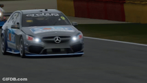 A Race Car That Has The Number 9 On The Front GIF