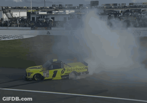 A Race Car With The Number 1 On It Is Smoking GIF