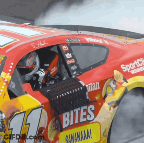 A Race Car With The Number 11 On The Side Of It GIF
