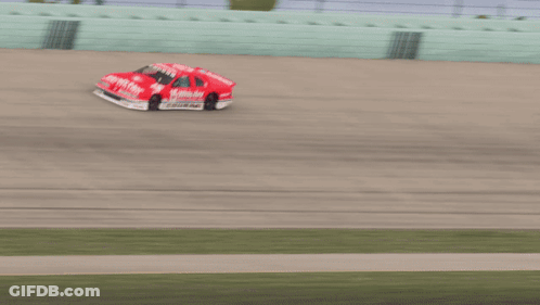 A Race Car With The Number 15 On It GIF