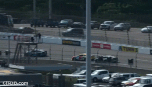 A Race Car With The Number 18 On The Front GIF