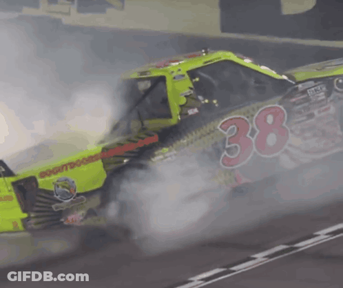 A Race Car With The Number 38 On The Side Of It GIF