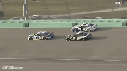 A Race Car With The Number 5 On It GIF