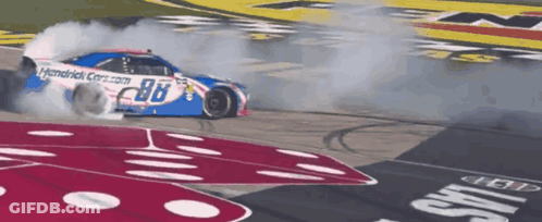 A Race Car With The Number 98 On The Side Of It GIF