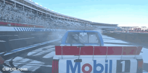 A Race Car With The Word Mobil On The Back GIF